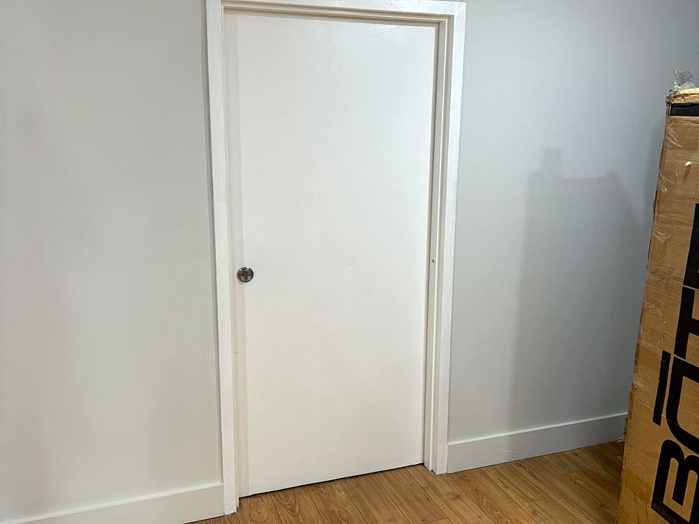 Freshly painted office with white door and trim