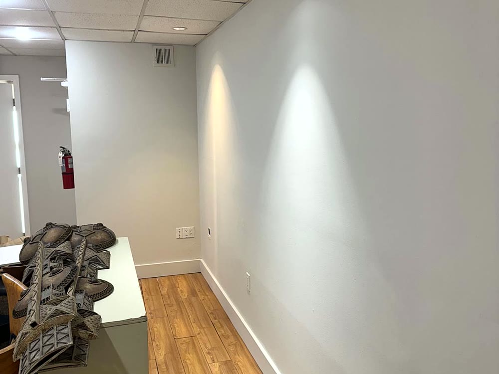 Repainted office hallway with clean gray walls